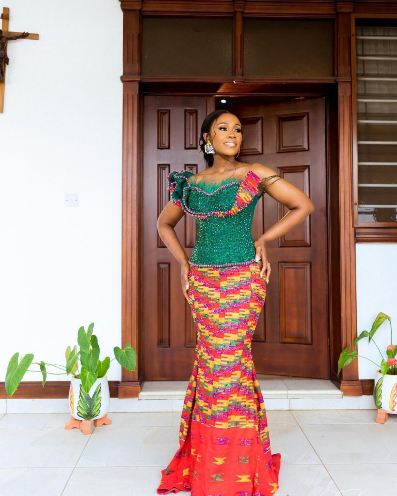 A bride in her two piece engagement kente