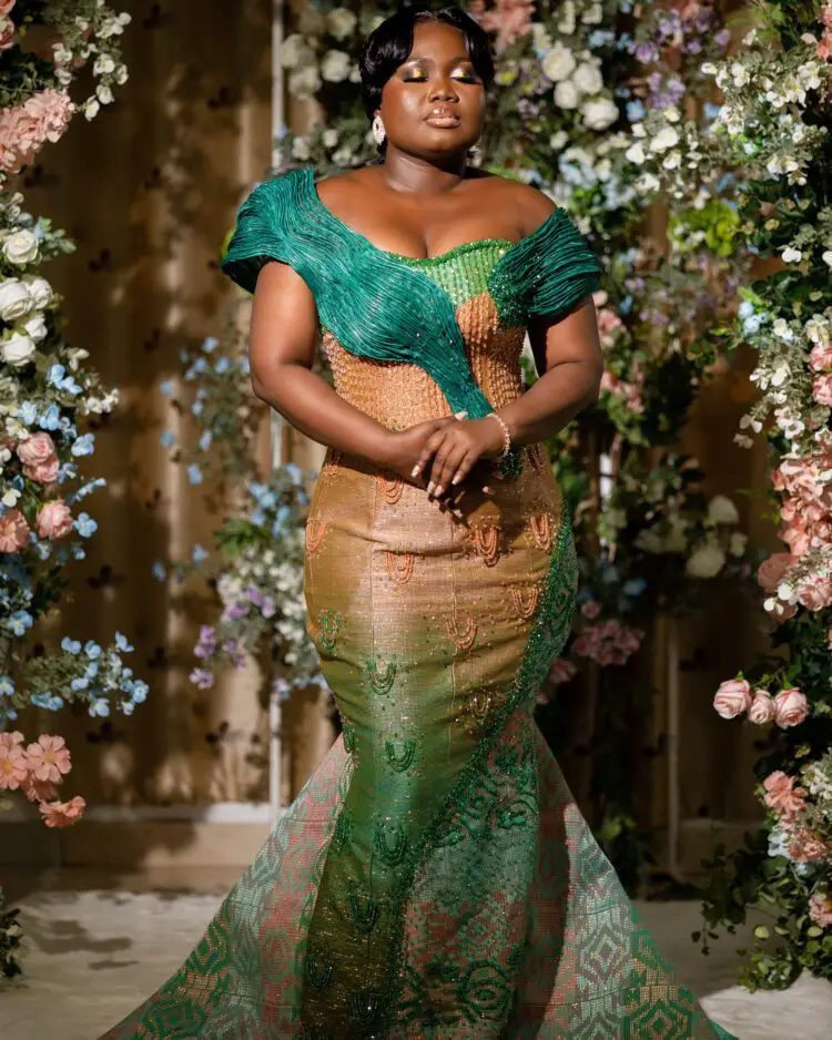 A beautiful Ghanaian bride wearing an ombre kente engagement dress