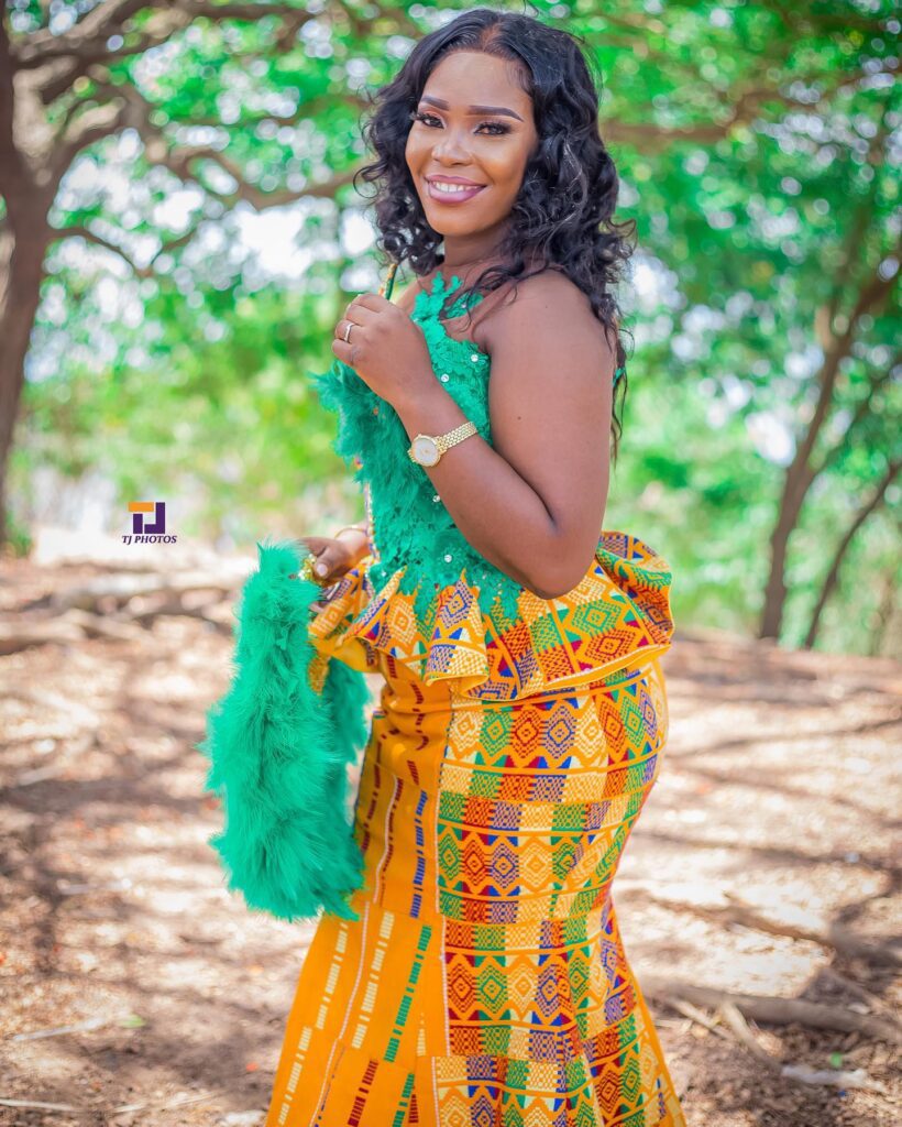 A Ghanaian bride in an engagement  kente outfit without beads