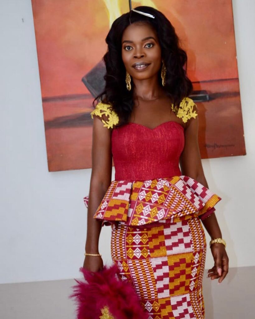 A Ghanaian bride in a simple engagement kente outfit without beads