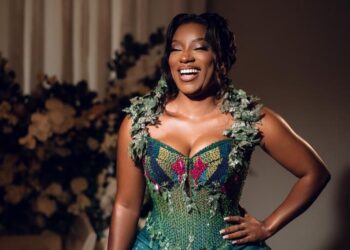 Sammy Gyamfi's wife in her green kente outfit at their enagagement ceremony.