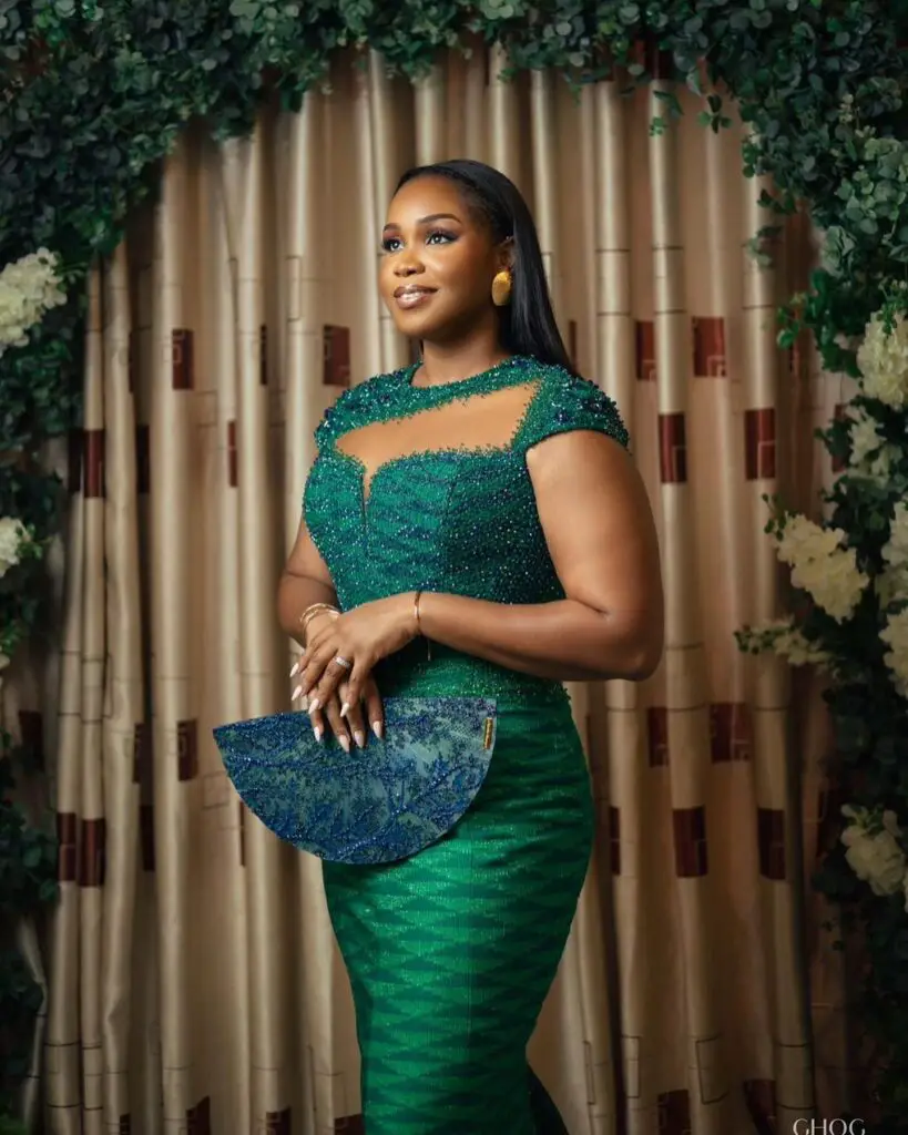 A Ghanaian bride in a green kente style dress