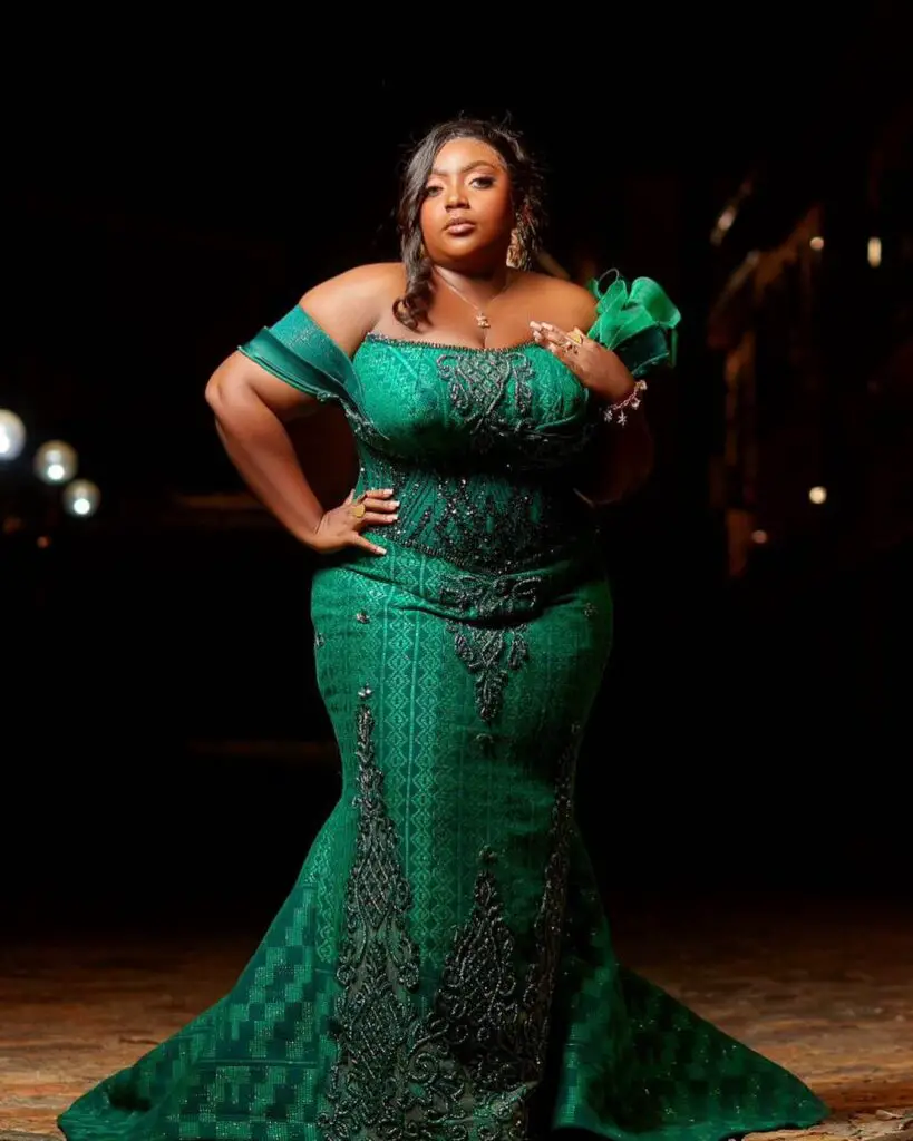 Ghanaian media personality AJ Sarpong in a green kente styled dress