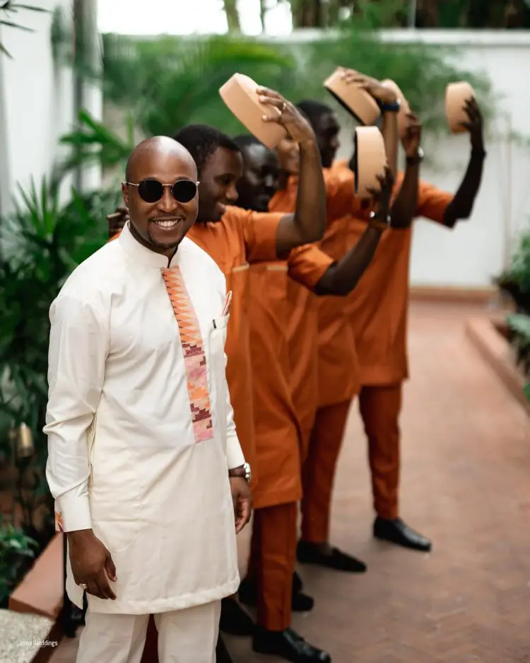 13 Ghanaian Groom and Groomsmen Poses raising their caps