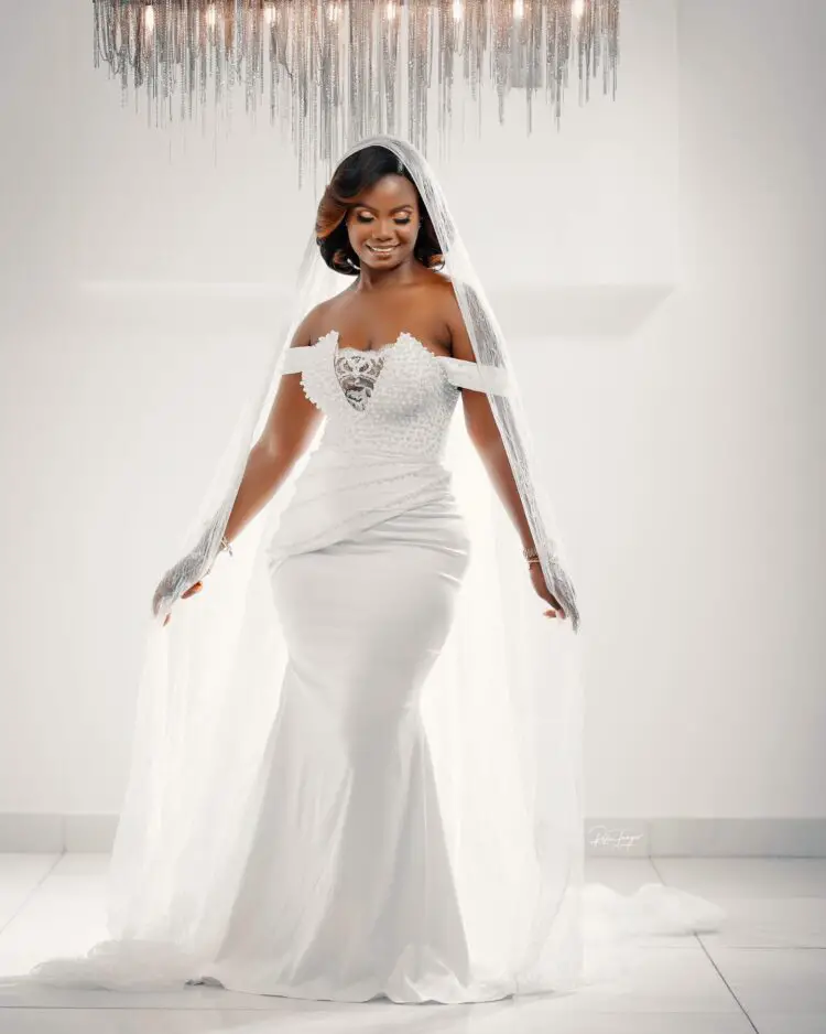 A Ghanaian bride in a long Civil Wedding Dress with veil