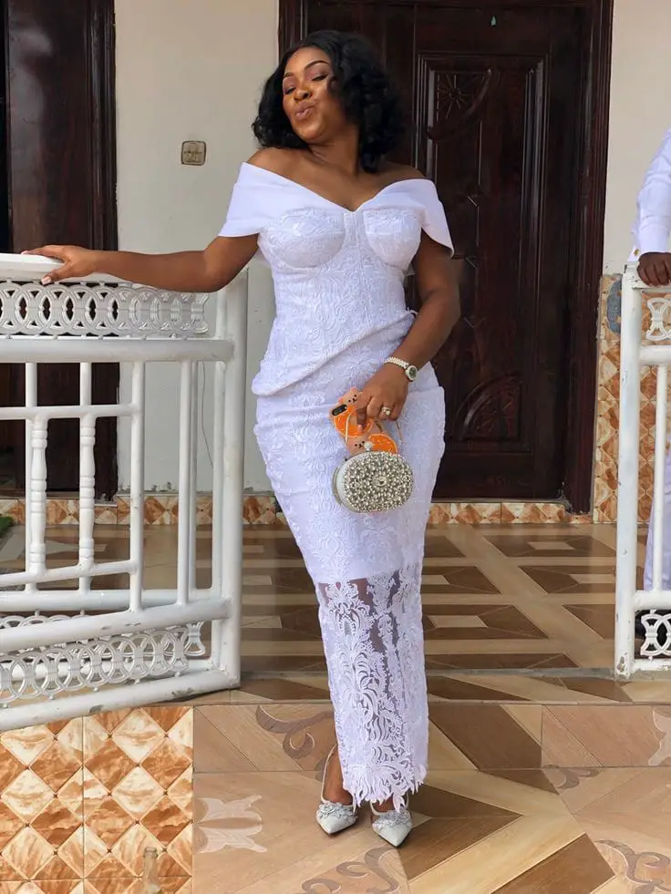 A long wedding guest white lace dress styles in Ghana 