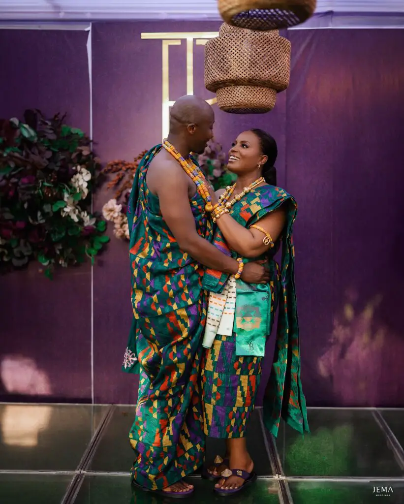 Irene and husband in matching kente