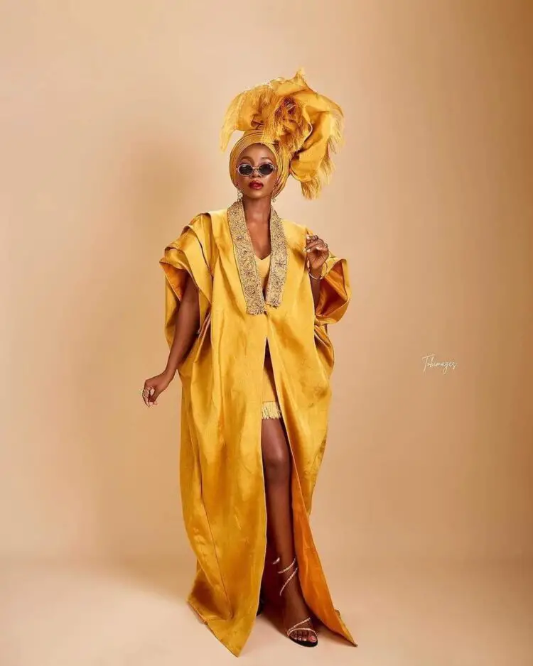 Ini Dima Okojie in a yellow dress