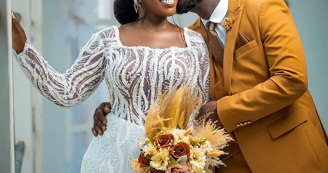 Perez Musik and his wife pose for pictures