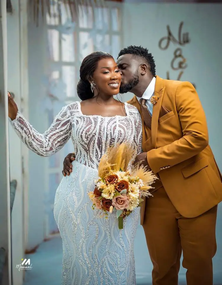 Perez Musik and his wife pose for pictures