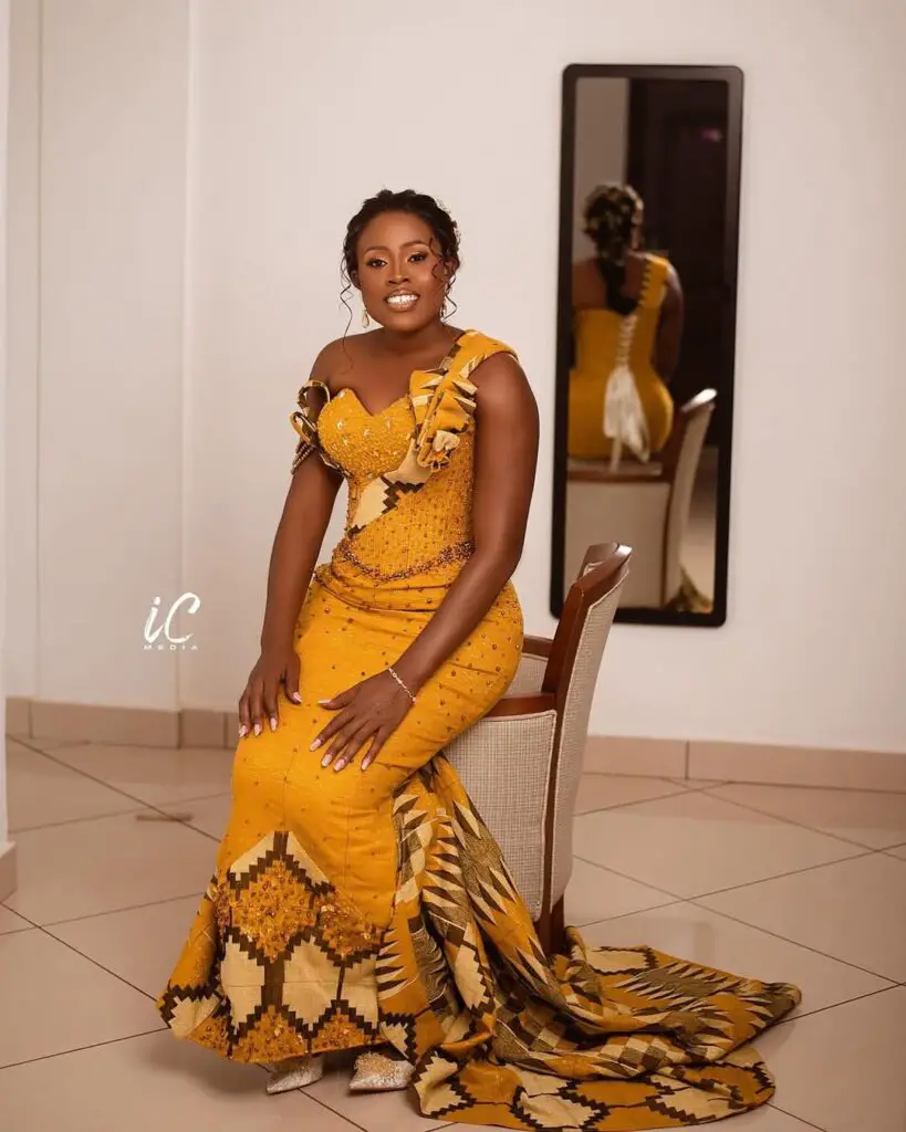 BRIDE IN YELLOW KENTE SITTING