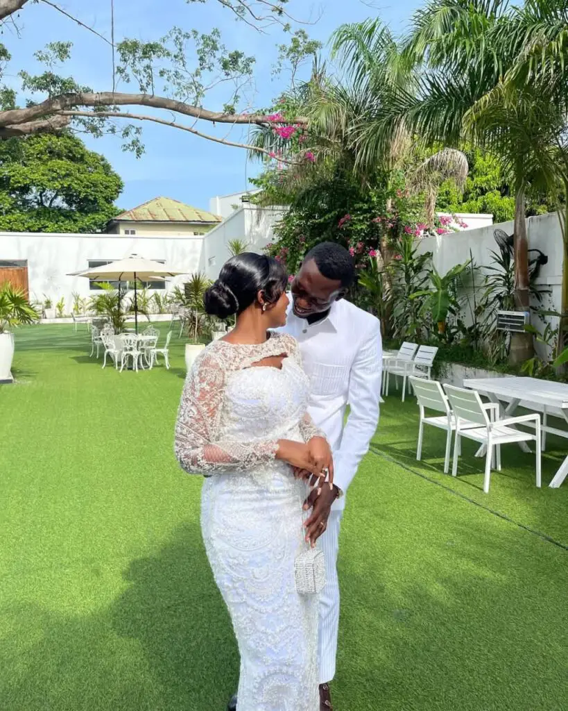 bride and groom in white