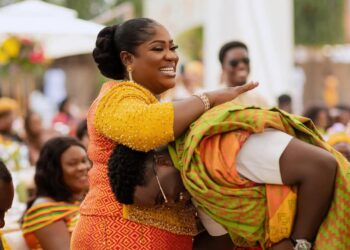 mother and son in kente