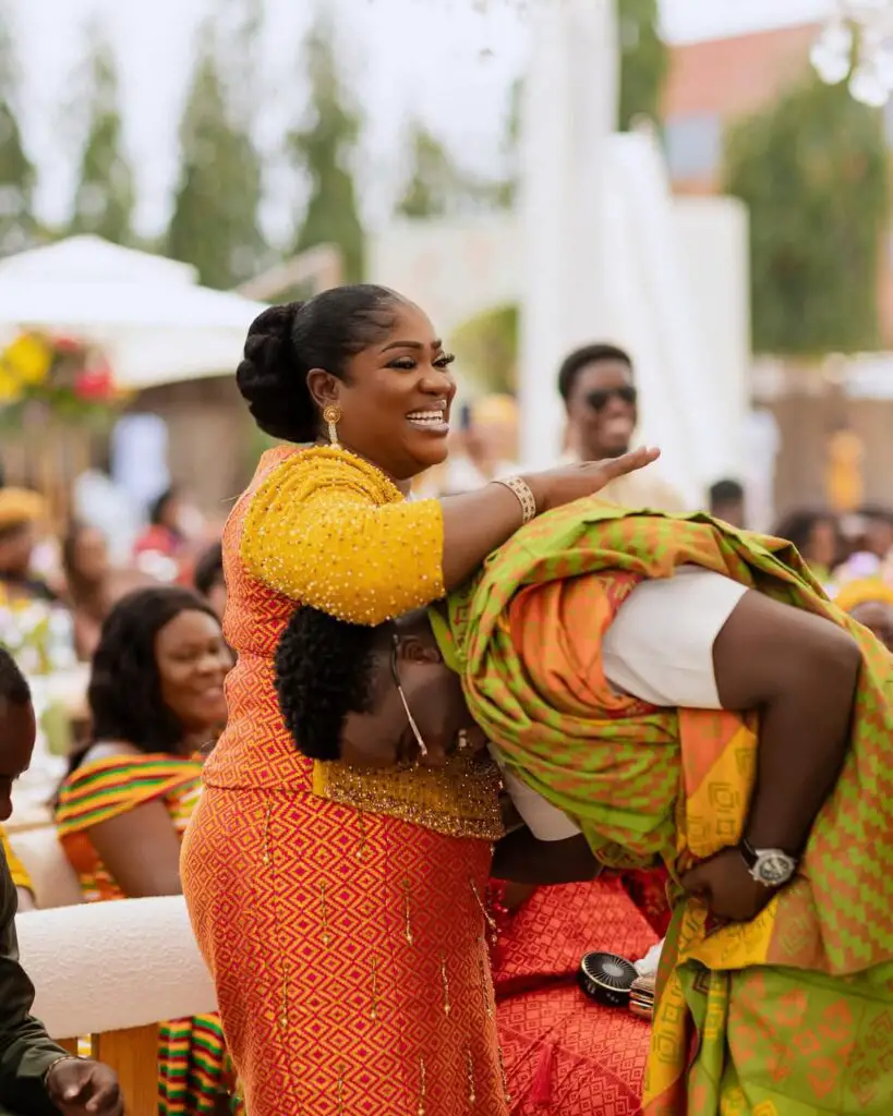 mother and son in kente