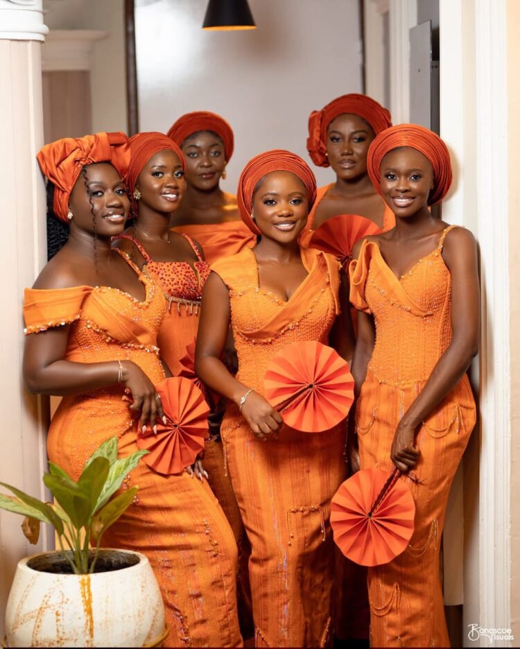 WEDDING MAIDS IN ORANGE SMOCK CLOTH